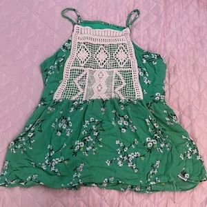 Flowey green/floral tank top with lace on the front.